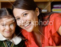 A woman and child smiling for the camera.